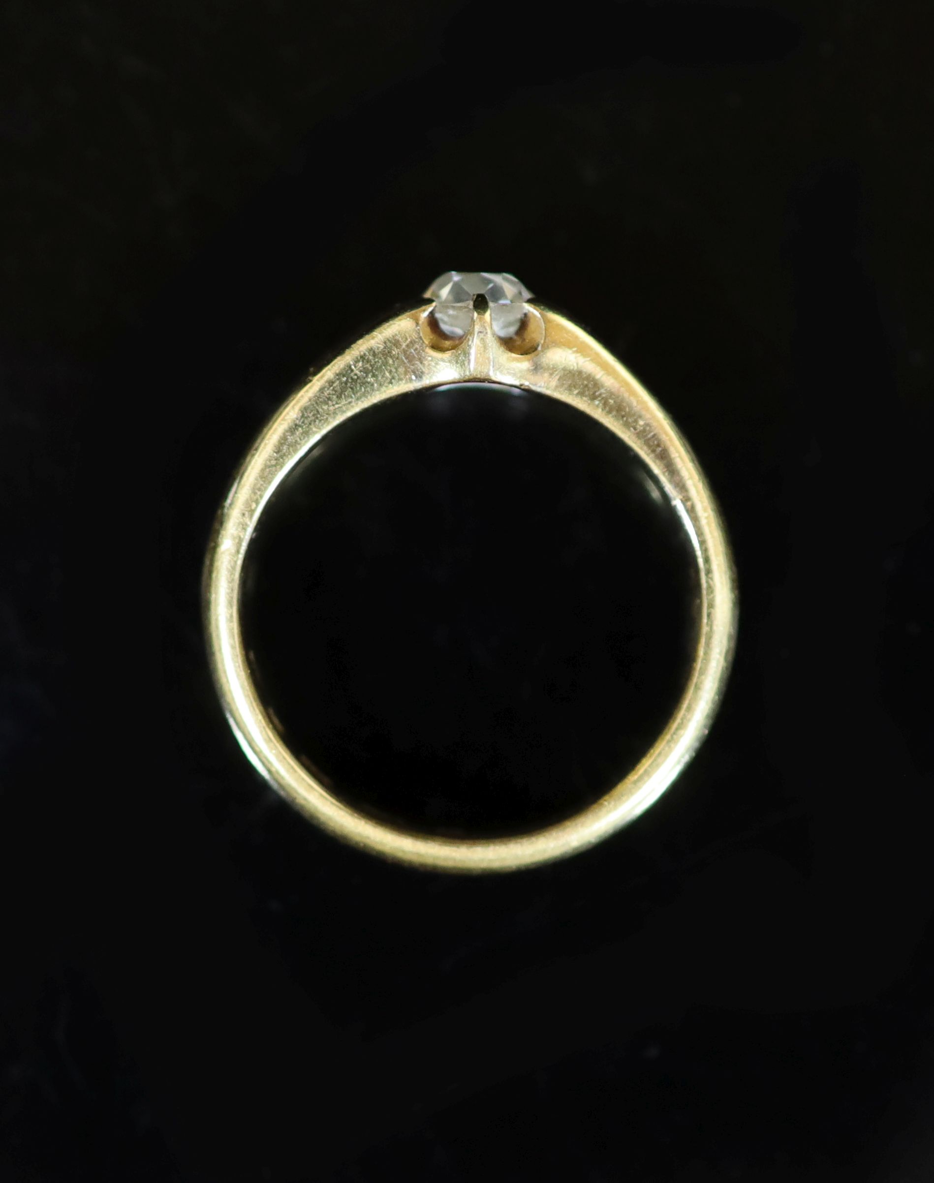A late Victorian 22ct yellow gold diamond solitaire ring, the claw-set oval cut diamond approximately 0.5ct